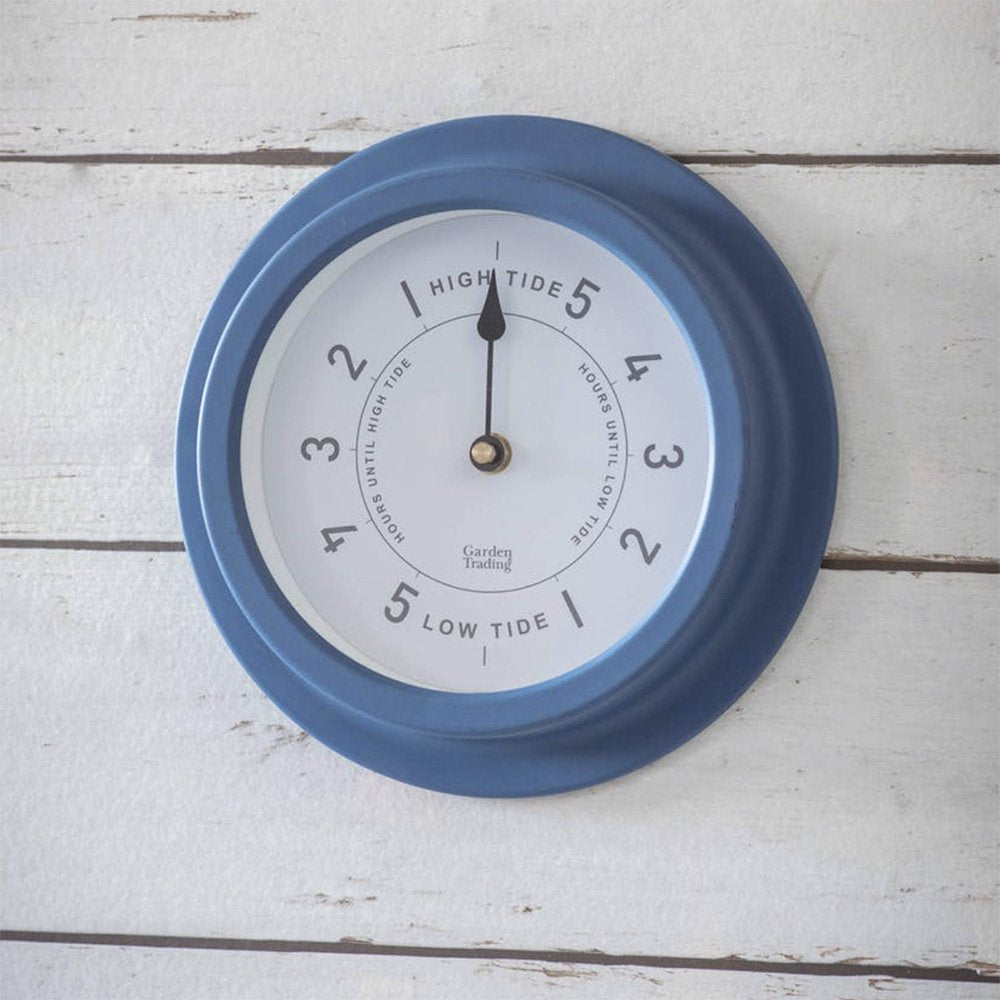 Wall mounted and weatherproof nautical tide clock crafted from powder coated steel in a soft coastal blue finish