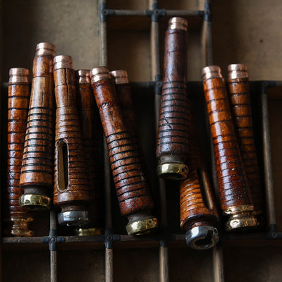 A selection of vintage wooden light pulls crafted from genuine antique textile bobbins. They all vary in shape and size with either a silver or gold metal end