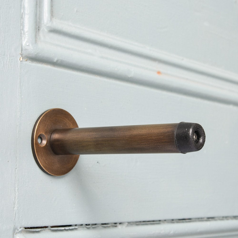 Projection Door Stop in Distressed Antique Brass.