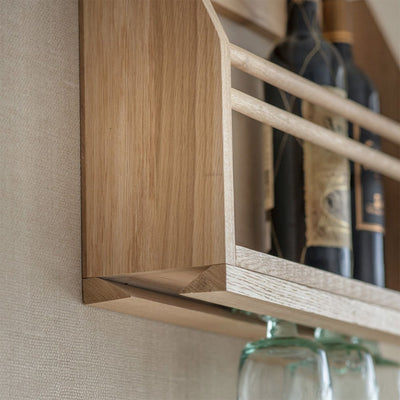 Side view of the wine shelf with a specially designed feature to slide wine glasses for hanging underneath