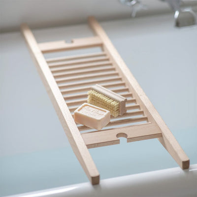 Simple slatted untreated beechwood bath bridge with wine glass holder at each end
