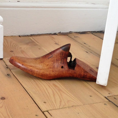 A unique door stop made from an old wooden shoe last recovered from a disused shoe factory